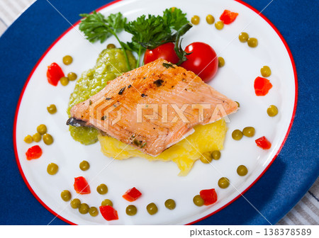Tasty fried trout fillet with mashed potatoes, guacamole, tomatoes and greens Tasty fried trout fillet with mashed potatoes, guacamole, tomatoes and greens 138378589
