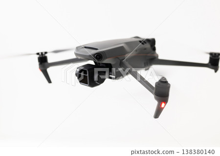 A drone hovering in the air A drone hovering in the air 138380140