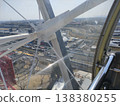 The racetrack is visible beyond the framework of the Ferris wheel. 138380255