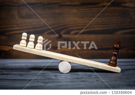 Social Inequality And Power Imbalance Represented By Chess Figures On Seesaw Social Inequality And Power Imbalance Represented By Chess Figures On Seesaw 138380604