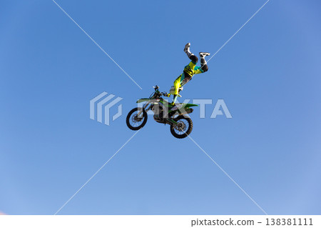 Extreme freestyle motocross jump high in the sky 138381111