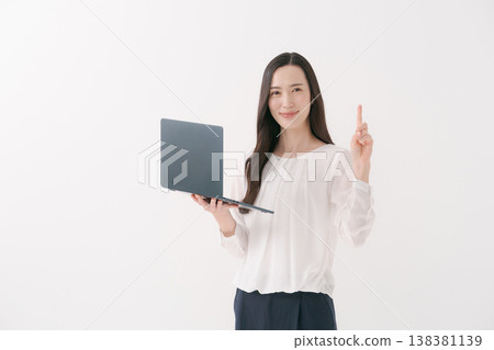A woman working on a PC A woman working on a PC 138381139