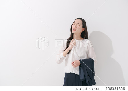 Image of a woman working in a suit during the hot summer. 138381838