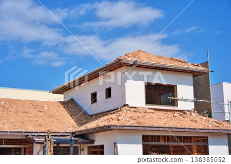Demolition site of an old wooden house; roof covered with earth. 138385052