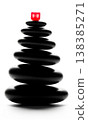 Stack of black zen stones in balance with glowing red cube, this business concept shows powerful leadership and sharp focus 138385271
