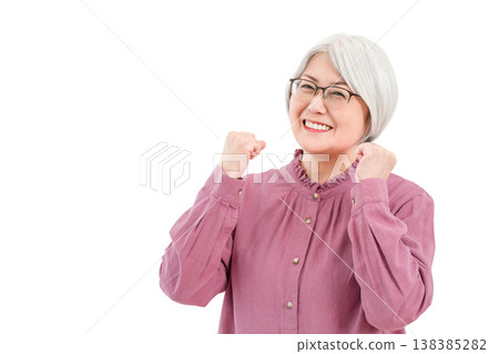 Smiling senior woman with gray and silver hair (fist pump, trying hard, rewarding, growth) Smiling senior woman with gray and silver hair (fist pump, trying hard, rewarding, growth) 138385282