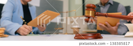 Teamwork of business lawyer meeting working hard about legal legislation in courtroom to help their customer. Teamwork of business lawyer meeting working hard about legal legislation in courtroom to help their customer. 138385817