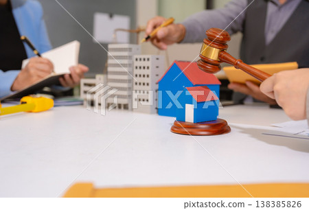 Concept of construction law, real estate development, renewable energy housing, and engineering collaboration. Concept of construction law, real estate development, renewable energy housing, and engineering collaboration. 138385826