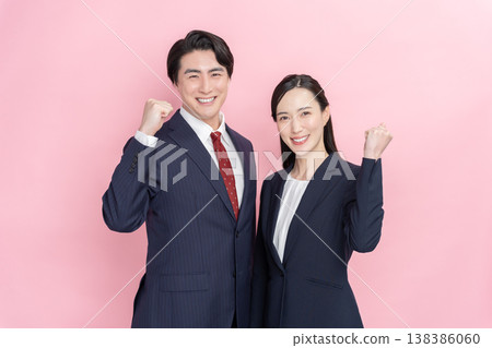 Businessmen and women cheering with triumphant gestures Businessmen and women cheering with triumphant gestures 138386060