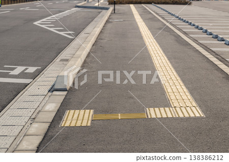 Braille blocks and drainage ditches (unmanned) symbolize barrier-free design and safety measures. Braille blocks and drainage ditches (unmanned) symbolize barrier-free design and safety measures. 138386212