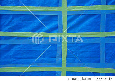 Blue tarp with masking tape Blue tarp with masking tape 138386417