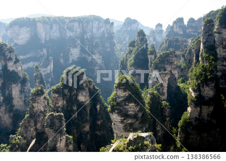 Awesome view of natural quartz sandstone pillars of the Tianzi Mountains (Avatar Mountains) in the Zhangjiajie National Forest Park ( Wulingyuan), Hunan Province, China. Fabulous landscape.this Awesome view of natural quartz sandstone pillars of the Tianzi Mountains (Avatar Mountains) in the Zhangjiajie National Forest Park ( Wulingyuan), Hunan Province, China. Fabulous landscape.this 138386566
