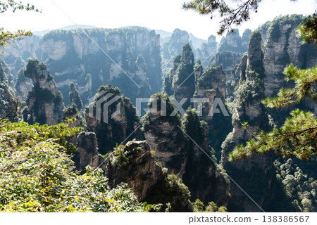 Awesome view of natural quartz sandstone pillars of the Tianzi Mountains (Avatar Mountains) in the Zhangjiajie National Forest Park ( Wulingyuan), Hunan Province, China. Fabulous landscape.this Awesome view of natural quartz sandstone pillars of the Tianzi Mountains (Avatar Mountains) in the Zhangjiajie National Forest Park ( Wulingyuan), Hunan Province, China. Fabulous landscape.this 138386567