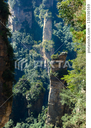 Awesome view of natural quartz sandstone pillars of the Tianzi Mountains (Avatar Mountains) in the Zhangjiajie National Forest Park ( Wulingyuan), Hunan Province, China. Fabulous landscape.this Awesome view of natural quartz sandstone pillars of the Tianzi Mountains (Avatar Mountains) in the Zhangjiajie National Forest Park ( Wulingyuan), Hunan Province, China. Fabulous landscape.this 138386569