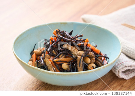 Simmered hijiki seaweed with carrots, soybeans, and fried tofu - a Japanese side dish. 138387144
