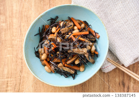 Simmered hijiki seaweed with carrots, soybeans, and fried tofu - a Japanese side dish. Simmered hijiki seaweed with carrots, soybeans, and fried tofu - a Japanese side dish. 138387145