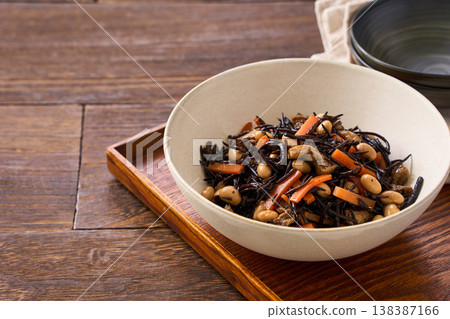 Simmered hijiki seaweed with carrots, soybeans, and fried tofu - a Japanese side dish. 138387166