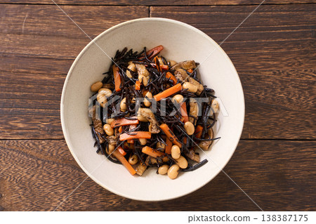 Simmered hijiki seaweed with carrots, soybeans, and fried tofu - a Japanese side dish. Simmered hijiki seaweed with carrots, soybeans, and fried tofu - a Japanese side dish. 138387175