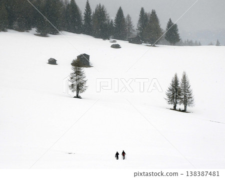 Trekking in the dolomites mountains under a heavy snow in winter Trekking in the dolomites mountains under a heavy snow in winter 138387481