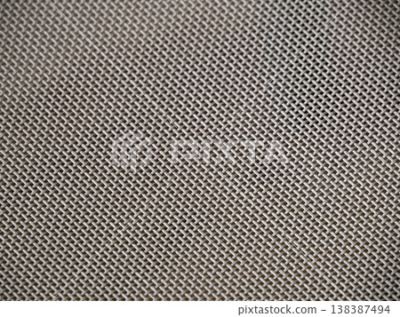 detail of the plastic fabric weave on a chair 138387494