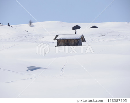 wooden hut covered by snow in armentarola pralongia dolomites mountains panorama 138387595