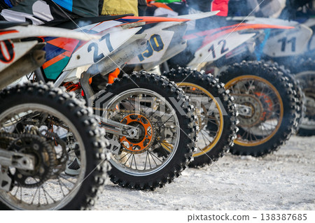 Row motocross dirt bikes lined up 138387685