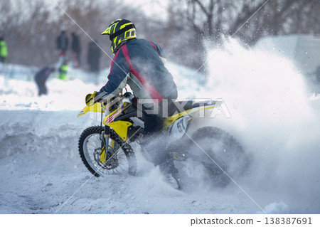 Motocross rider on dirt bike Motocross rider on dirt bike 138387691