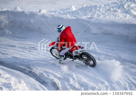 Motocross rider on dirt bike 138387692