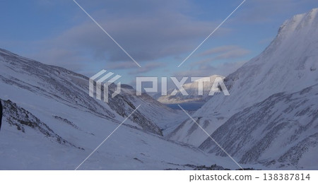 Looking down at the sea from a glacier 138387814