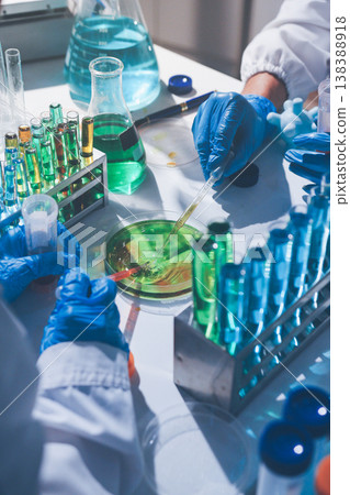 Science, laboratory and woman with pipette, test tube and biotech solution in research. Medical innovation, scientist or lab technician in study for healthcare, medicine and vaccine results feedback. Science, laboratory and woman with pipette, test tube and biotech solution in research. Medical innovation, scientist or lab technician in study for healthcare, medicine and vaccine results feedback. 138388918