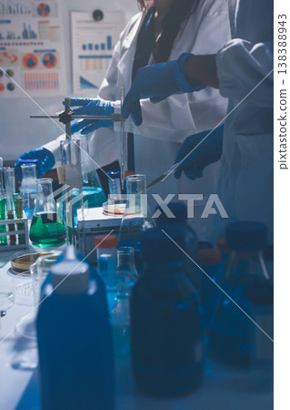 Science, laboratory and woman with pipette, test tube and biotech solution in research. Medical innovation, scientist or lab technician in study for healthcare, medicine and vaccine results feedback. Science, laboratory and woman with pipette, test tube and biotech solution in research. Medical innovation, scientist or lab technician in study for healthcare, medicine and vaccine results feedback. 138388943