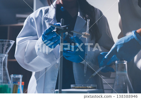Science, laboratory and woman with pipette, test tube and biotech solution in research. Medical innovation, scientist or lab technician in study for healthcare, medicine and vaccine results feedback. Science, laboratory and woman with pipette, test tube and biotech solution in research. Medical innovation, scientist or lab technician in study for healthcare, medicine and vaccine results feedback. 138388946