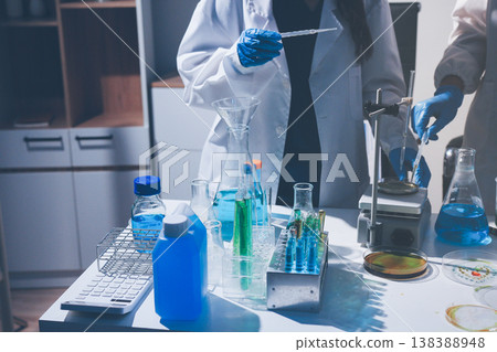 Science, laboratory and woman with pipette, test tube and biotech solution in research. Medical innovation, scientist or lab technician in study for healthcare, medicine and vaccine results feedback. Science, laboratory and woman with pipette, test tube and biotech solution in research. Medical innovation, scientist or lab technician in study for healthcare, medicine and vaccine results feedback. 138388948