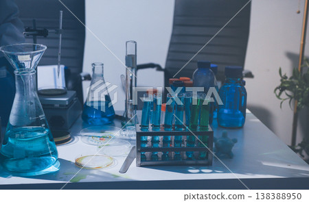 Science, laboratory and woman with pipette, test tube and biotech solution in research. Medical innovation, scientist or lab technician in study for healthcare, medicine and vaccine results feedback. 138388950