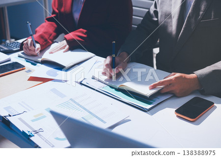 Diverse business people having a team meeting in an office Diverse business people having a team meeting in an office 138388975