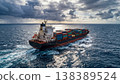 A large container ship navigates through open ocean under dramatic storm  138389524
