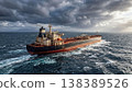 Large Oil Tanker Sailing Through Rough Ocean Under Dramatic Storm Clouds 138389526