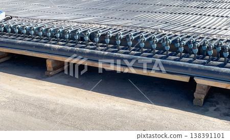 Professional installation of modern industrial cooling system with HDPE pipes and manifold fittings Professional installation of modern industrial cooling system with HDPE pipes and manifold fittings 138391101