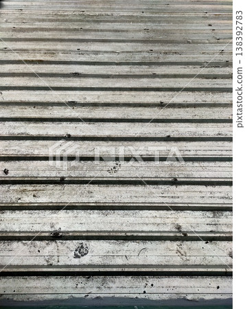 Rusty metal slats with paw prints gritty, rhythmic, and rich in industrial texture and story. Rusty metal slats with paw prints gritty, rhythmic, and rich in industrial texture and story. 138392783