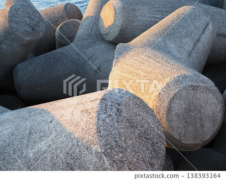 Stacked wave-dissipating blocks, the art of tetrapods, copy space Stacked wave-dissipating blocks, the art of tetrapods, copy space 138393164