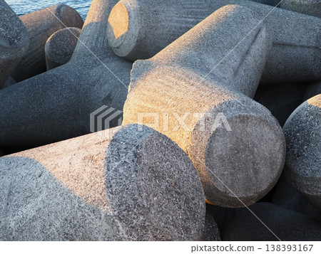 Stacked wave-dissipating blocks, the art of tetrapods, copy space Stacked wave-dissipating blocks, the art of tetrapods, copy space 138393167