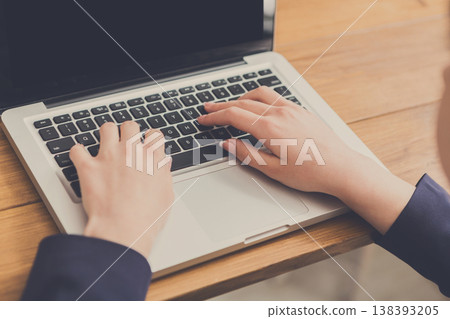 Business woman working in office, typing on laptop, close-up, shallow depth of field Business woman working in office, typing on laptop, close-up, shallow depth of field 138393205