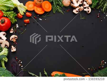 Healthy food background, fresh vegetables. Cooking ingredients for italian cuisine, top view on black, copy space 138393210