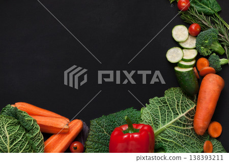 Fresh vegetables background. Vegetarian cooking. Healthy natural food on black with copy space. Fresh vegetables background. Vegetarian cooking. Healthy natural food on black with copy space. 138393211