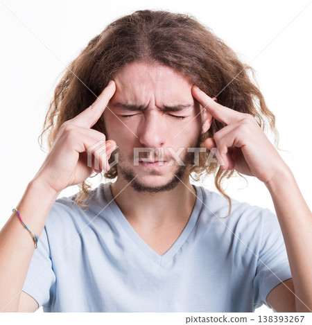 Headache. Concentrated pensive man thinking about something, holding fingers on temple, white isolated studio background 138393267