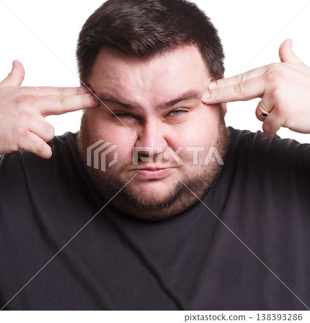 Stressed exhausted man with fingers on temple suffering from headache, white isolated studio background Stressed exhausted man with fingers on temple suffering from headache, white isolated studio background 138393286