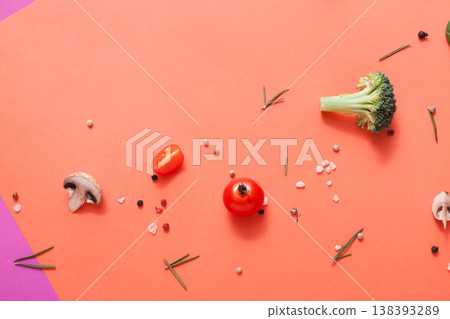 Diet, detox and healthy food concept - top view flat lay of fresh organic raw vegetables on abstract bright background. Ingredients for salad - broccoli, mushroom, carrot, cherry tomato, spinach 138393289