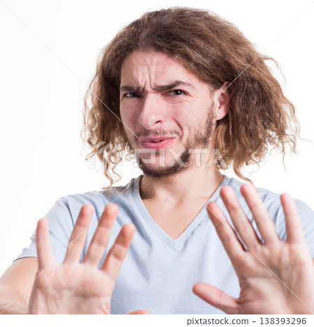 Man expressing disgust on face, grimacing on white studio background, cutout. Negative emotions 138393296