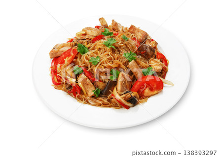 Asian food. Fried Thai glass Rice noodles with meat and vegetables. Chinese transparent glass rice vermicelli fried with meat, parsley and tomatoes. Korean funchoza cellophane noodles. 138393297