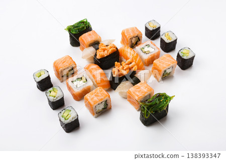 Sushi platter isolated on white background. Japanese food restaurant delivery - maki california rolls set, above view 138393347